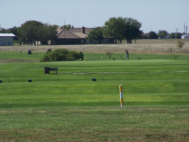 A golfer uses the practice facilities at Hidden Hills Golf Club